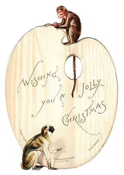 Two monkeys on a palette-shaped Christmas card