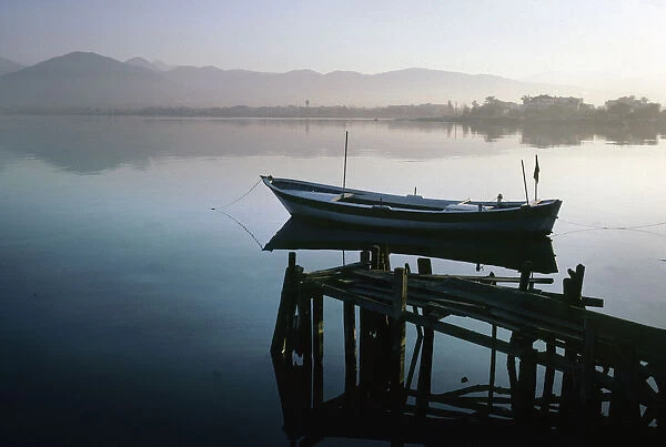 A moored boat and wooden jetty, Fethiye, Turkey