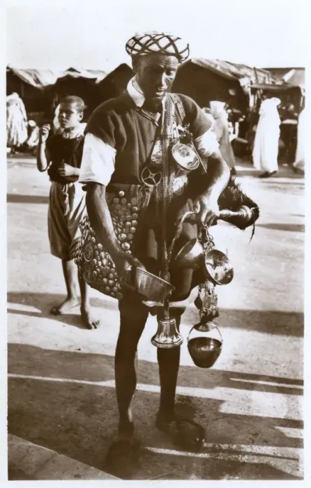 Framed Print : Moroccan water carrier with containers and bell Framed Print : Moroccan water carrier with containers and bell