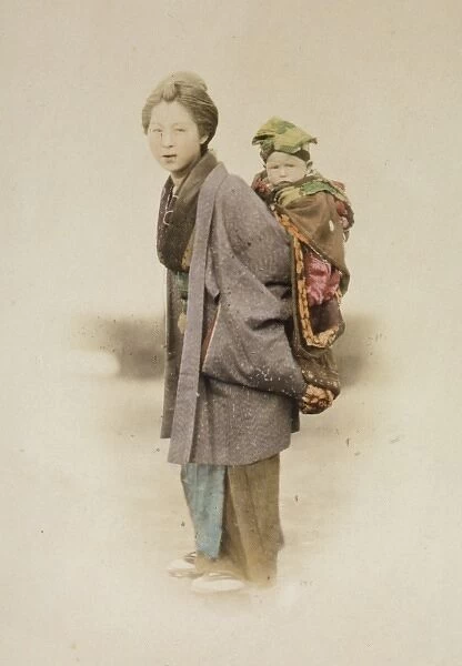 Mother carrying child on her back
