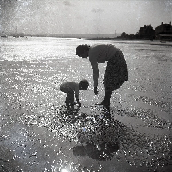 Mother and child on St Ives beach at sunset