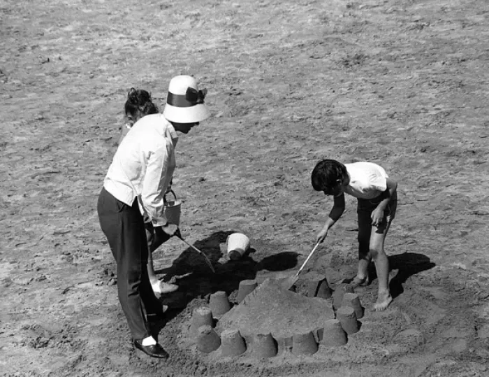 Framed Print : Mother and children making sandcastle Framed Print : Mother and children making sandcastle