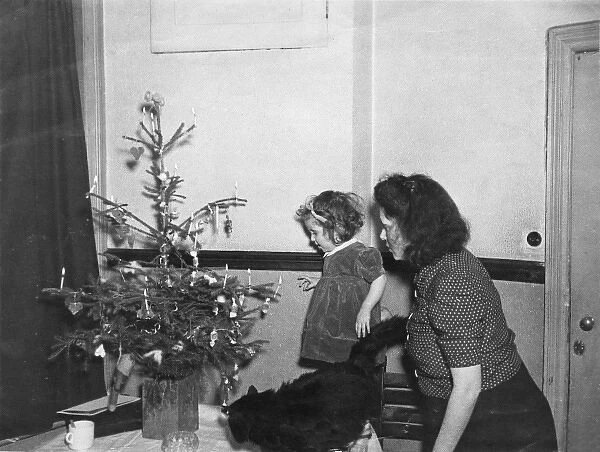 Mother, daughter and Christmas tree