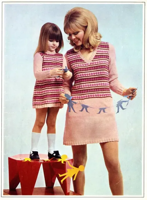 Framed Print : Mother and daughter in matching knitted outfits Framed Print : Mother and daughter in matching knitted outfits