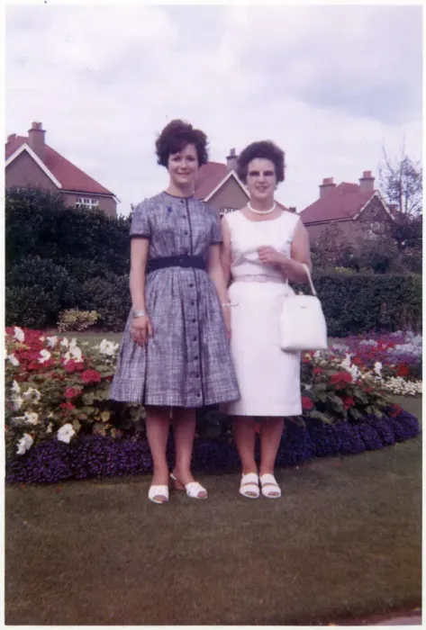 Framed Print : Mother and daughter in pretty suburban back garden Framed Print : Mother and daughter in pretty suburban back garden