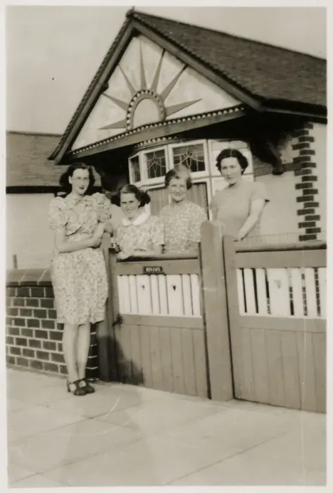 Framed Print : Mother and daughters by the gate of a lovely bungalow Framed Print : Mother and daughters by the gate of a lovely bungalow