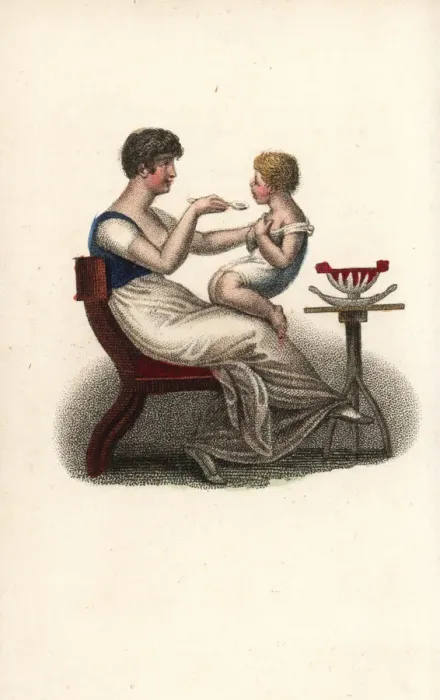 Framed Print : Mother feeding her child on her lap Framed Print : Mother feeding her child on her lap