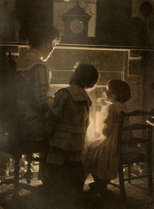 Framed Print : A mother tells fairy tales to her children in front of a glowing fire. Date: 1912 Framed Print : A mother tells fairy tales to her children in front of a glowing fire. Date: 1912