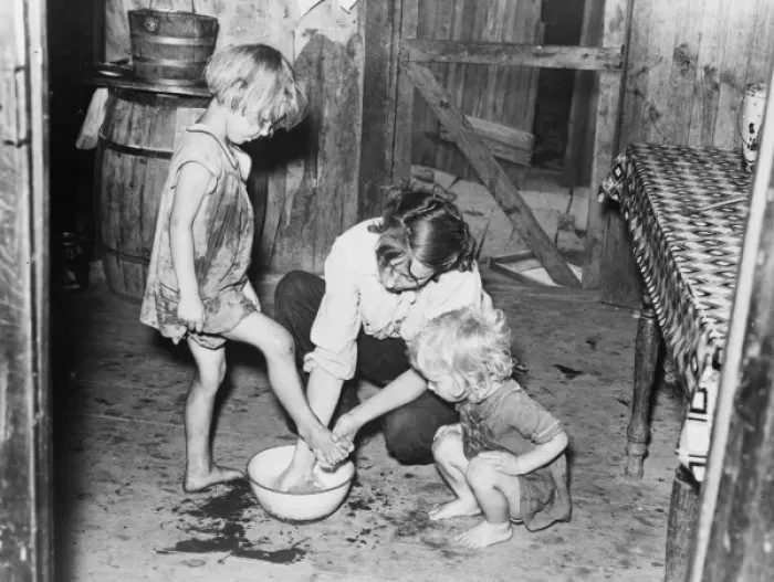 Framed Print : Mother washing feet and cleaning up daughters in sharecroppe Framed Print : Mother washing feet and cleaning up daughters in sharecroppe