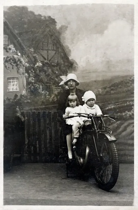 Framed Print : Mother and her two young children - studio photo on bike Framed Print : Mother and her two young children - studio photo on bike
