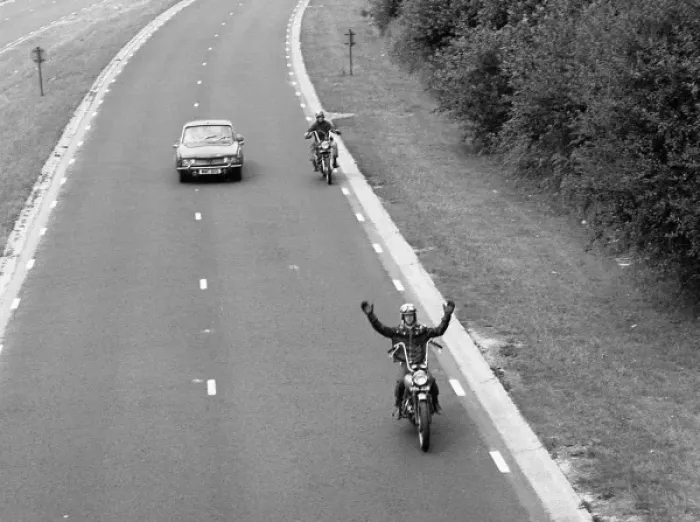 Framed Print : Two motorcyclists overtaking a car Framed Print : Two motorcyclists overtaking a car