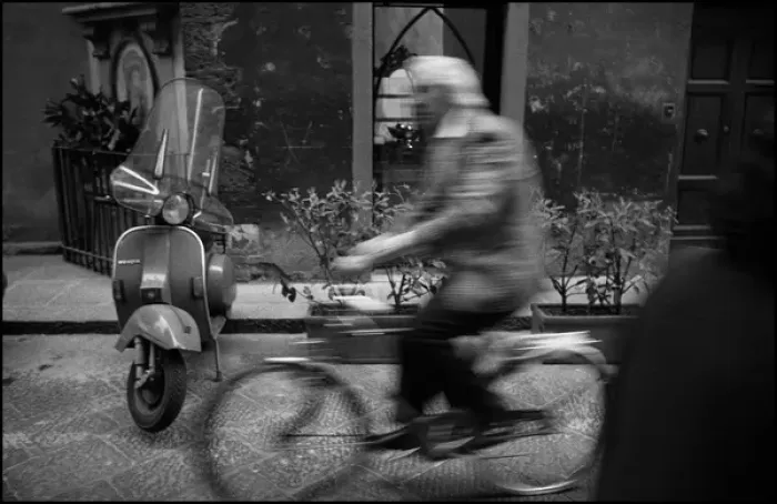 Framed Print : Moving figure on bike, motor scooter, Italy Framed Print : Moving figure on bike, motor scooter, Italy
