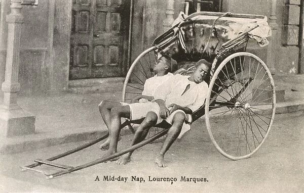 Mozambique - Maputo - Two Rickshaw Boys take a nap