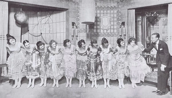 Mr Barnett Goodwood and girls in a scene from Fifty, Fifty Ltd at the Comedy Theatre, New York (1919) Date: 1919