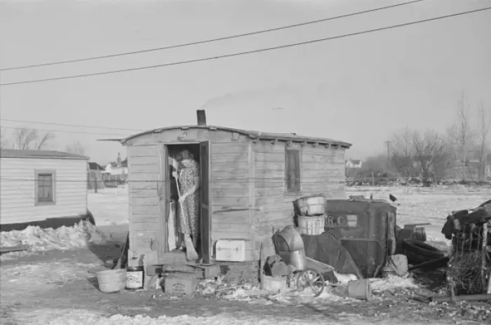 Framed Print : Mrs. Charles Benning sweeping steps of shack in Shantytown Framed Print : Mrs. Charles Benning sweeping steps of shack in Shantytown