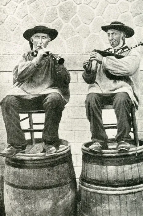 Framed Print : Musicians seated on barrels, Brittany, Northern France Framed Print : Musicians seated on barrels, Brittany, Northern France