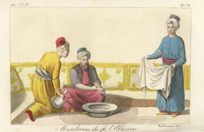 Framed Print : A Muslim man performing his ablutions before prayer