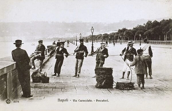 Naples, Italy - Fishermen pulling in their catch