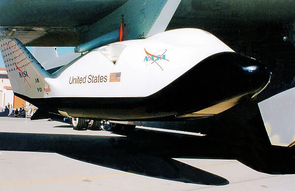 NASA X-38 V-131, at an open day on Edwards Air Force Base, mounted under the wing of its B-52 mothership. Date: circa 2000