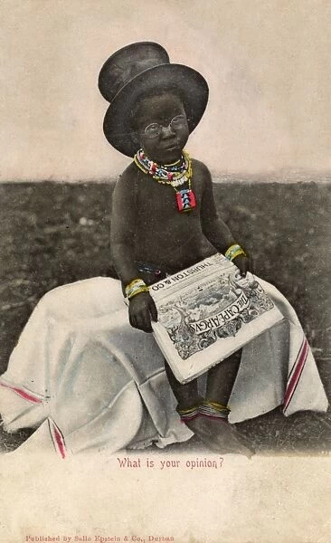 Native boy reading Cape Argus newspaper, South Africa