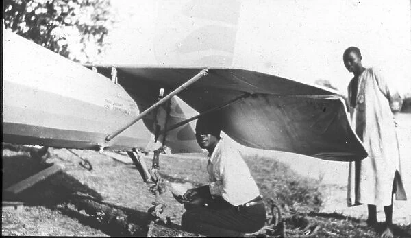 Natives repair tailplane (McCarthy Island)
