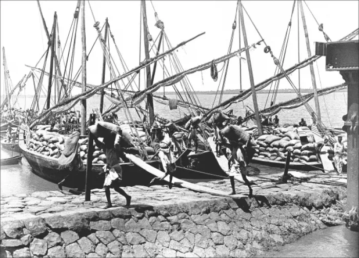 Framed Print : Natives unloading cargo from boats Framed Print : Natives unloading cargo from boats