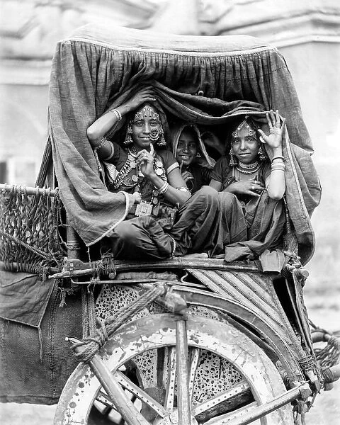 Nautch women in a cart, India