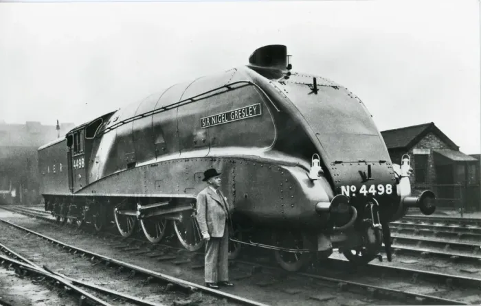 Framed Print : Nigel Gresley standing alongside his A4 class steam engine Framed Print : Nigel Gresley standing alongside his A4 class steam engine