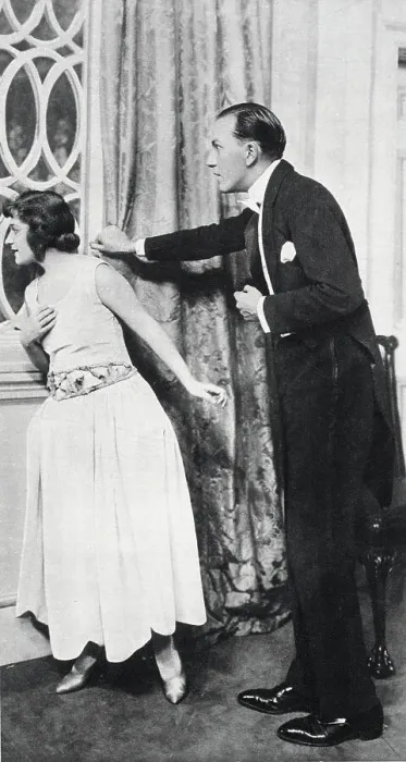 Framed Print : Noel Coward acts in his own play with Ann Trevor. Dressed for dinner, they peer anxiously out of a window. Date: 1923 Framed Print : Noel Coward acts in his own play with Ann Trevor. Dressed for dinner, they peer anxiously out of a window. Date: 1923