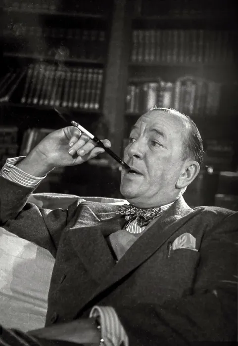 Framed Print : Noel Coward sits with cigarette in holder during rehearsal of Relative Values which opened at The Savoy Theatre in November 1951 Date: 1951 Framed Print : Noel Coward sits with cigarette in holder during rehearsal of Relative Values which opened at The Savoy Theatre in November 1951 Date: 1951