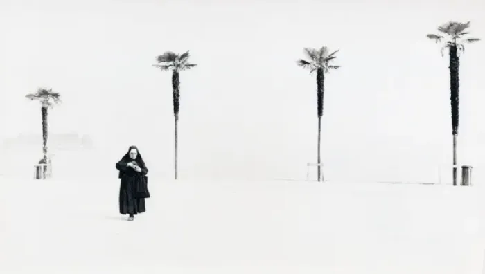 Framed Print : Nun with background of four palm trees Framed Print : Nun with background of four palm trees