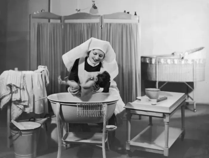 Framed Print : Nurse Bathes Baby / 1933 Framed Print : Nurse Bathes Baby / 1933