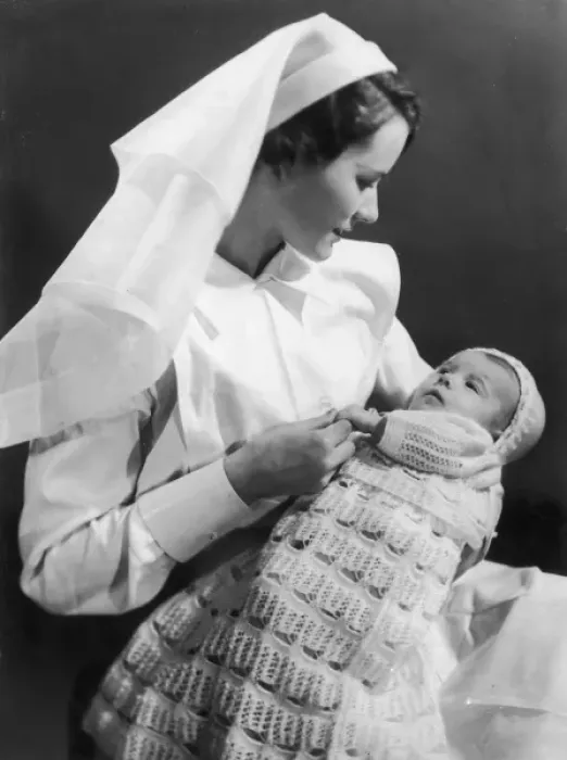 Framed Print : Nurse holding baby Framed Print : Nurse holding baby