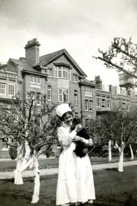 Framed Print : Nurse holding cat Framed Print : Nurse holding cat