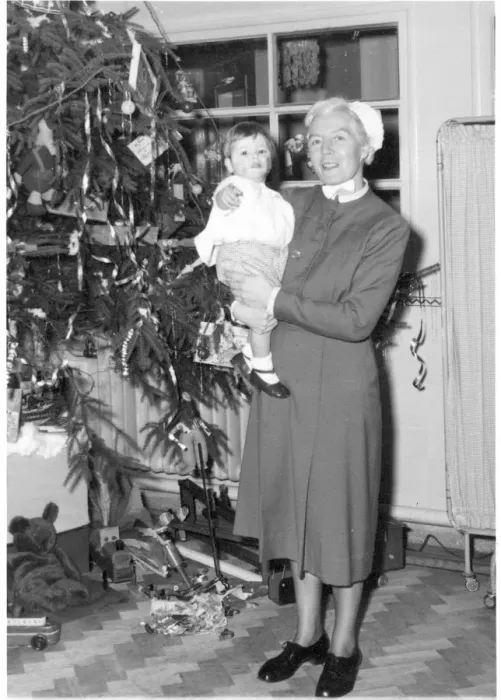 Framed Print : Nurse holding child next to Christmas tree Framed Print : Nurse holding child next to Christmas tree