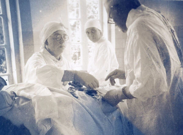 Nurses assisting doctor during surgery
