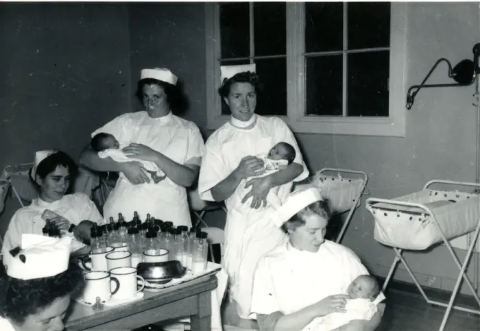 Framed Print : Nurses with babies in hospital nursery
