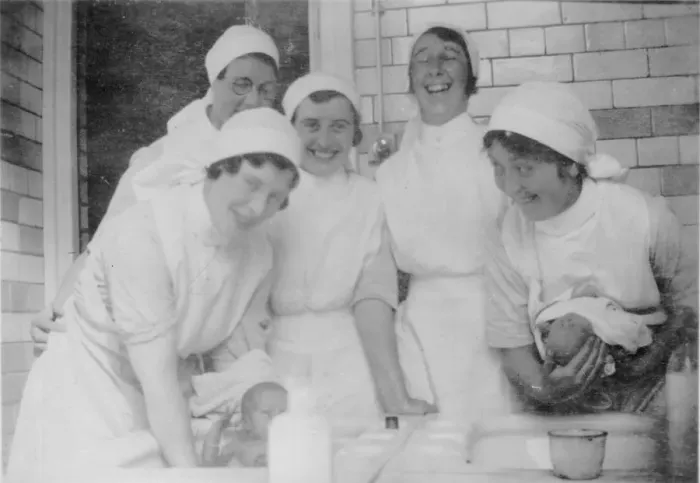 Framed Print : Nurses bathing babies Framed Print : Nurses bathing babies
