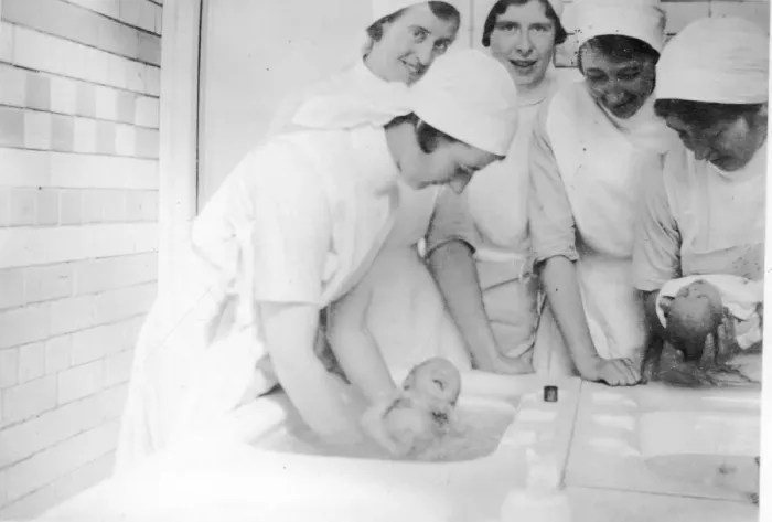 Framed Print : Nurses bathing newborn babies Framed Print : Nurses bathing newborn babies