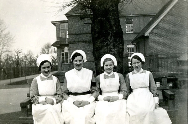 Nurses on bench outside hospital