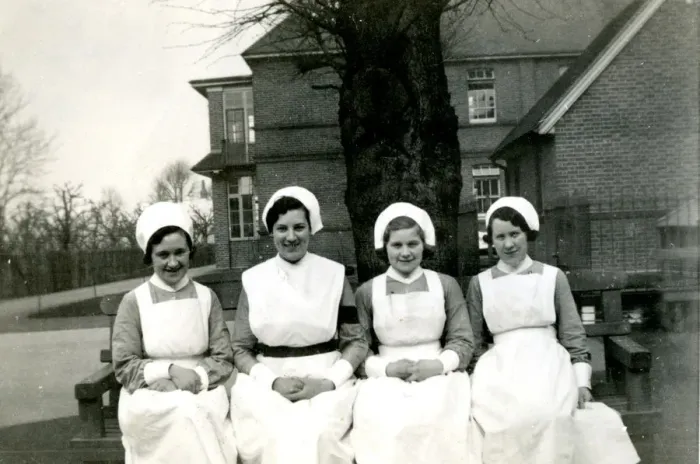 Framed Print : Nurses on bench outside hospital Framed Print : Nurses on bench outside hospital