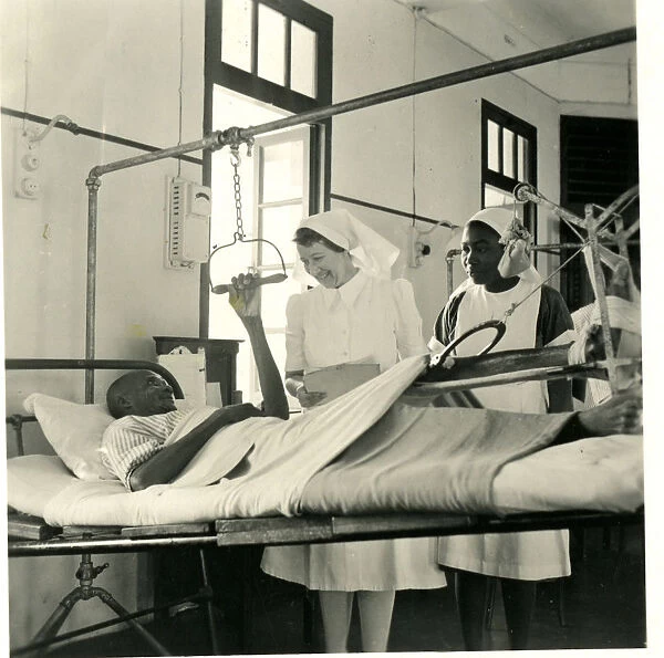 Nurses with patient in traction at the African Hospital, Lag