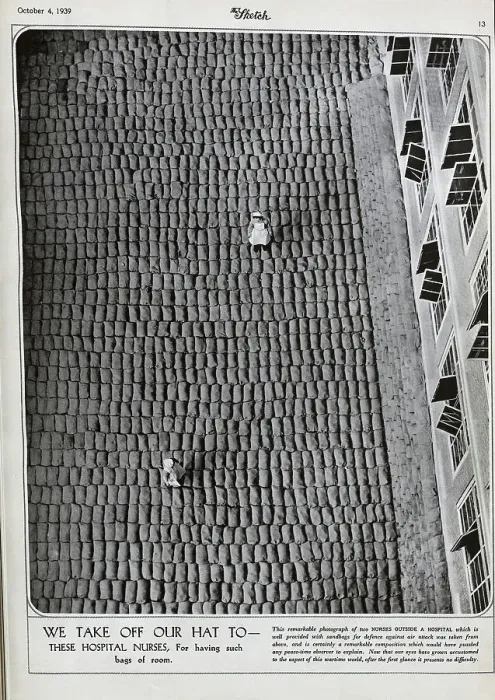 Framed Print : Two nurses in uniform, on thousands of sandbags Framed Print : Two nurses in uniform, on thousands of sandbags