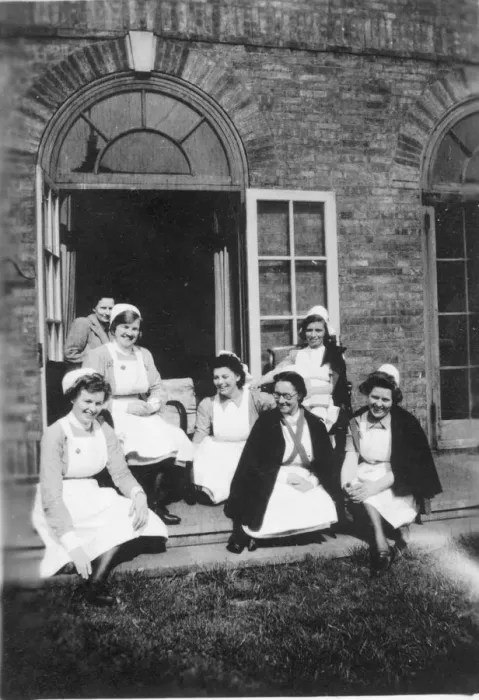 Framed Print : Six nurses and woman on steps Framed Print : Six nurses and woman on steps
