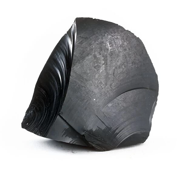 Obsidian. A glassy black material, formed when volcanic lava cools rapidly