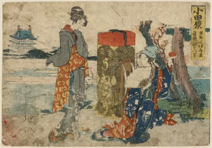 Framed Print : Odawara. Print shows two travelers, a woman standing next to a large trunk Framed Print : Odawara. Print shows two travelers, a woman standing next to a large trunk