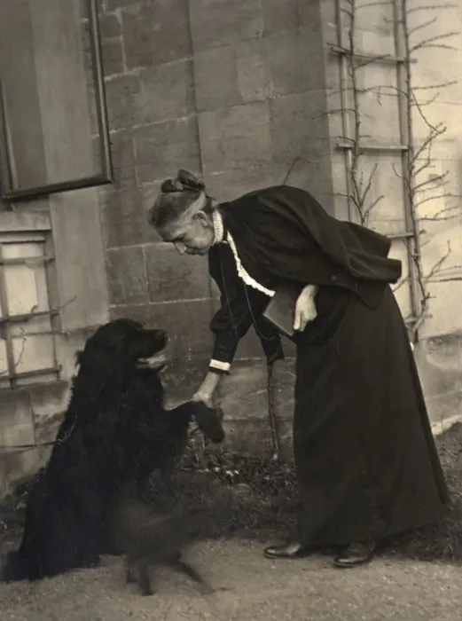 Framed Print : Old lady teaching her dog Framed Print : Old lady teaching her dog