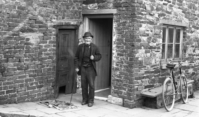 Framed Print : Old man outside house Framed Print : Old man outside house