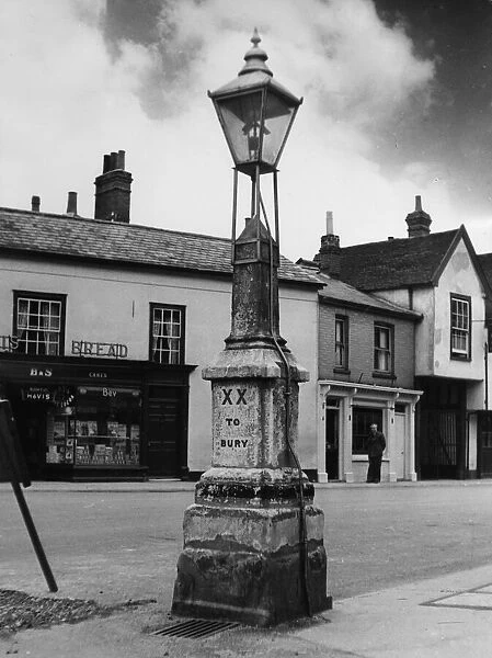 An old milestone in the main street of Hadleigh, Suffolk, England