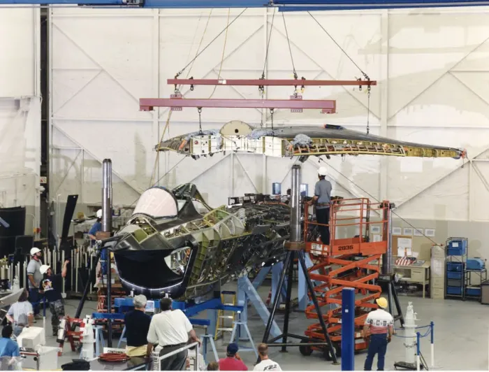 Framed Print : The one-piece wing is lowered into place on the Boing X? Framed Print : The one-piece wing is lowered into place on the Boing X?